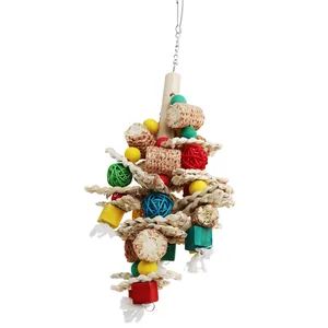 Detailed view of large parrot toy with natural corn cobs and colorful rattan balls