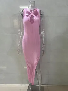 Close-up of pink ribbed knit bodycon dress featuring a sexy cut-out and side slit