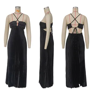 Detailed view of black pleated maxi dress with strappy backless design on mannequin