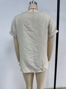 Back view of a casual light beige short-sleeved women's T-shirt displayed on a mannequin