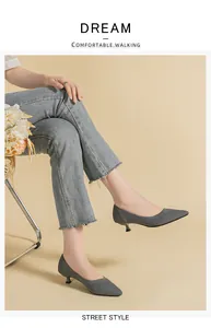 Side view of grey breathable mesh knit pointed toe kitten heel pumps on feet