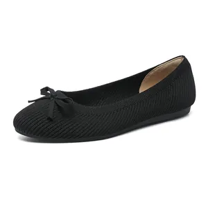 Classic black round-toe knit ballet flats featuring elegant bow detail for women