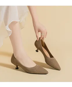 Detailed view showing the breathable fly-knit mesh texture of these pointed-toe heels