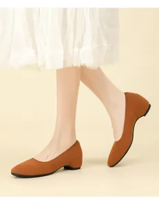 Detailed view of comfortable brown knit square-toe wedge shoes for women on a model