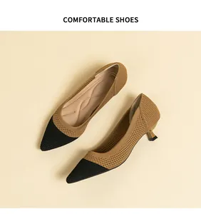 Detail of breathable two-tone fly-knit pumps with elegant pointed toe and kitten heels