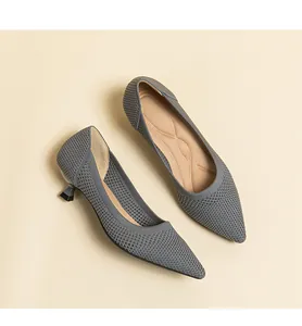 Detailed view of grey knitted pointed toe kitten heels with breathable mesh texture.