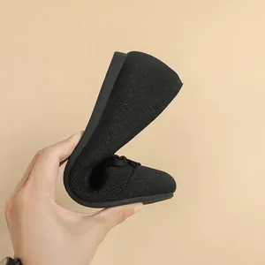 Scarpe piatte flessibili in maglia nera da donna con punta tonda e fiocco