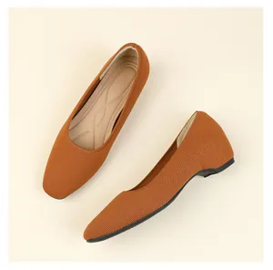 Detailed close-up view of brown knitted square-toe flats for women's daily commute