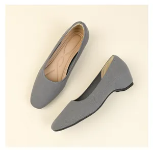 Detail view of gray knit flats with square toe and comfortable cushioned inner wedge design
