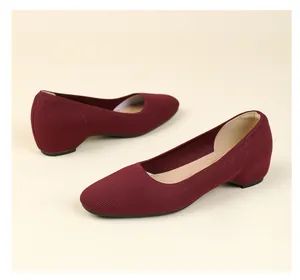 Detailed view of the burgundy knitted fabric texture on these square toe women's flats