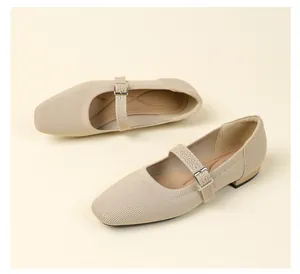 Close-up view of breathable beige flyknit Mary Jane flats with buckle strap