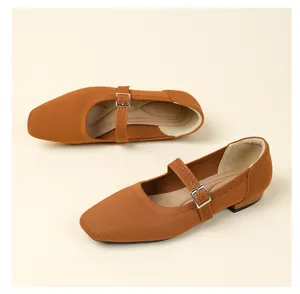 Close-up of breathable brown fly-knit Mary Jane flats with adjustable buckle strap