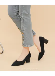 Elegant black ribbed block-heel pumps with a pointed toe and stylish V-cut design