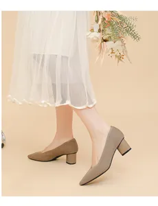 Close-up of khaki ribbed knit pointed toe pumps with chunky heels and V-mouth design