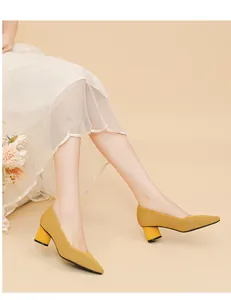 Elegant yellow ribbed knit block heel pumps with an elegant pointed toe and V-cut.
