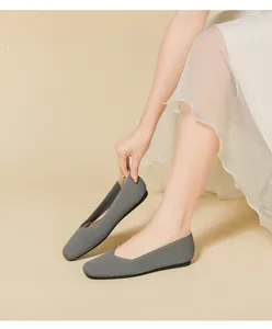 Close-up of grey square toe flyknit flats showing the breathable ribbed texture