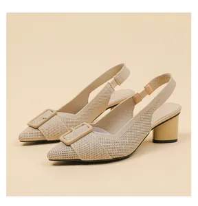 Detail shot of beige knitted pointed-toe block heel slingback sandals with buckle