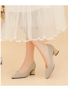 Close-up of beige ribbed chunky heel pumps with elegant pointed V-cut design