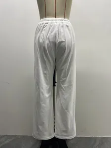 Back view detail of white retro corduroy high-waist wide-leg trousers on mannequin torso