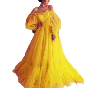 Elegant yellow off-the-shoulder tulle evening dress with long puff sleeves and big swing