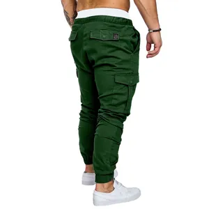 Rear view of dark green cargo pants for men with multiple pockets and elastic cuffs.
