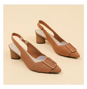 Side view of brown knitted pointed-toe slingback sandals with chunky heels and buckles