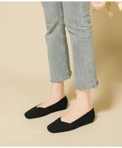 Detailed macro view of breathable black knit flats featuring a stylish square toe design