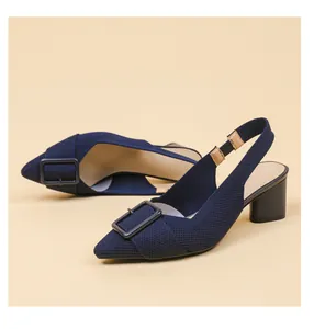 Detailed close-up view of navy blue knitted pointed toe slingback heels with buckle