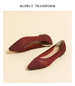 Detail view of burgundy pointed-toe knit flat shoes with breathable mesh
