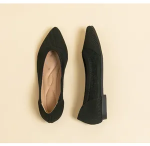 Top and side detail view of women's black knit pointed-toe flats for summer office wear.