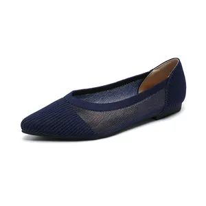 Navy blue knitted pointed toe flat shoes for women with breathable mesh design.