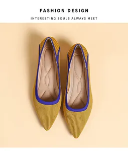 Top-down studio view of yellow knitted pointed-toe flats featuring blue trim detailing