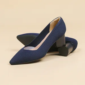 Elegant navy blue pointed-toe block heel pumps with ribbed knit texture for women