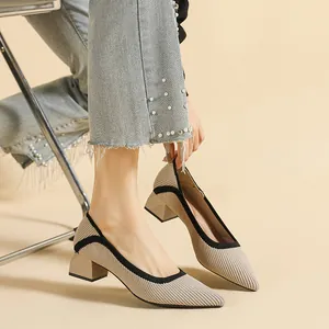 Elegant beige pointed-toe knitted pumps with comfortable block heels and black trim