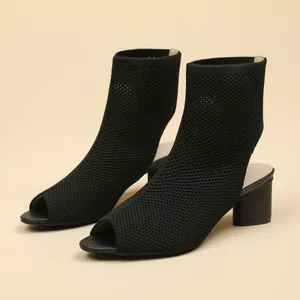 Elegant black peep-toe knit ankle boots featuring a steady block heel and breathable fabric