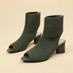 Sophisticated dark green peep-toe knit ankle boots featuring a steady chunky heel design