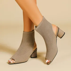 Detailed view of khaki knitted peep-toe chunky heel boots showing the textile texture