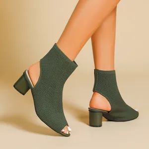 Detailed shot of the olive green knit peep-toe ankle boots featuring a cutout heel design