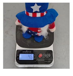 Independence Day faceless gnome doll weighing 46 grams on a digital kitchen scale.