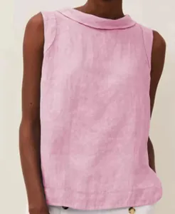 Close-up of pink cotton linen sleeveless top featuring a rolled round neckline details.