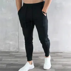 Slim-fit men's black joggers for gym and fitness with elastic cuffs and pockets.