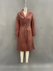 Full front view of a terracotta faux suede long trench coat for women on a mannequin