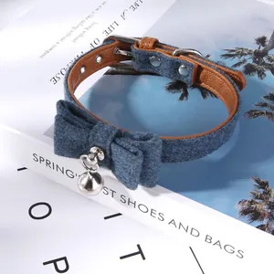 Stylish blue felt pet collar featuring a charming bow tie and silver bell for cats and dogs