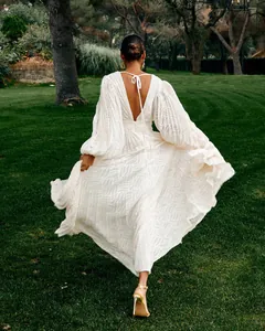 Detailed back view of white pleated jacquard maxi dress with lantern sleeves