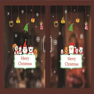 Pegatinas navideñas estáticas con Papá Noel y renos sobre una puerta de cristal