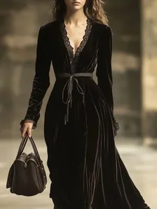 Close-up detail of French vintage dark velvet dress featuring exquisite black lace neckline