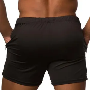Vista trasera de pantalones cortos deportivos negros para hombre con bolsillos de cremallera