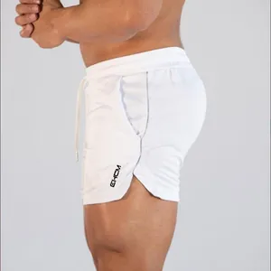 Close-up of men's white quick-dry athletic shorts with drawstring and side logo