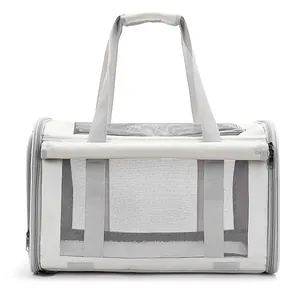 Side detail view of a portable light gray pet carrier with breathable mesh windows
