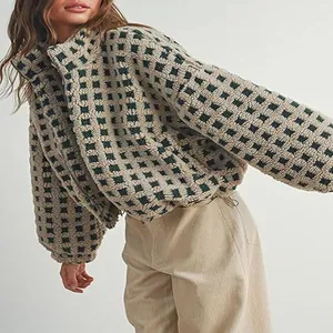 Detail view of women's checkered sherpa fleece jacket with cozy texture and loose fit.